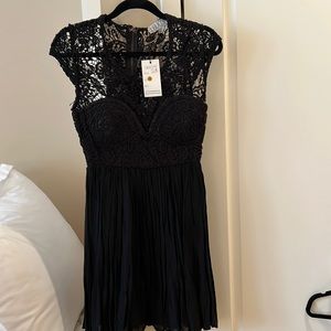 NWT, Brand new Love Cat lace bodice pleated black mini dress size Medium